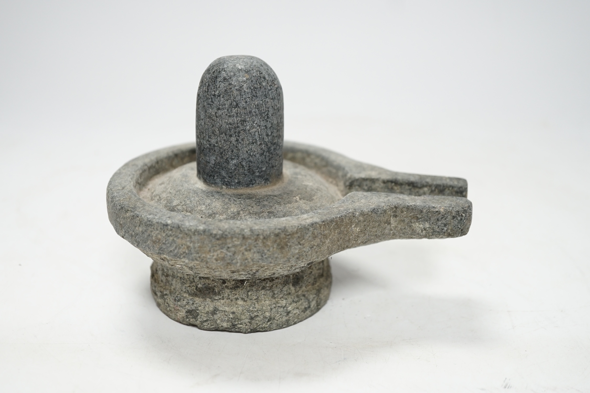 A granite Hindu Shiva Lingham, 11cm high